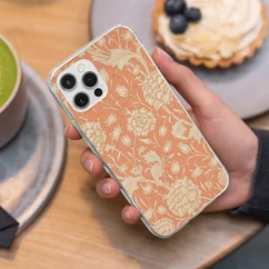Photo 16: the orange floral case held in a hand