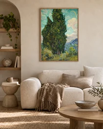 Photo 2: the poster framed above a bouclé sofa in an arched alcove
